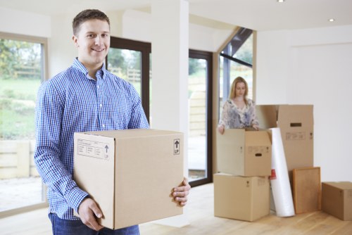 Packing materials and boxed belongings prepared for a move in Waddon