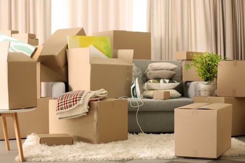 Packed boxes and furniture ready for mobile self storage in Waddon