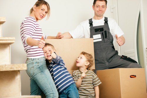 Removal workers protecting furniture during a Waddon house move
